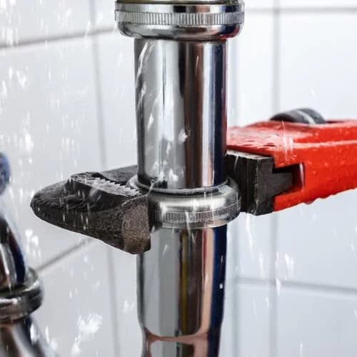 Plumber fixing an emergency leak